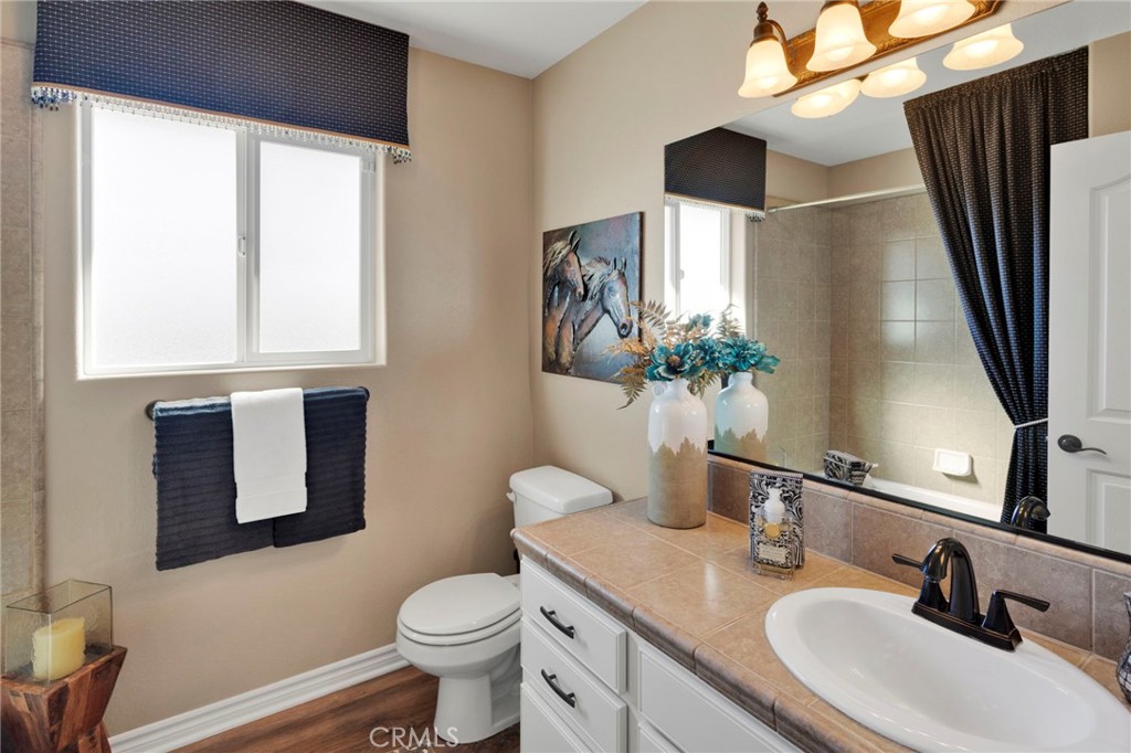 2909 Silver Ridge Drive Pinon Hills, CA 92372 - Photo 27 of 55 a bathroom with a toilet sink and mirror