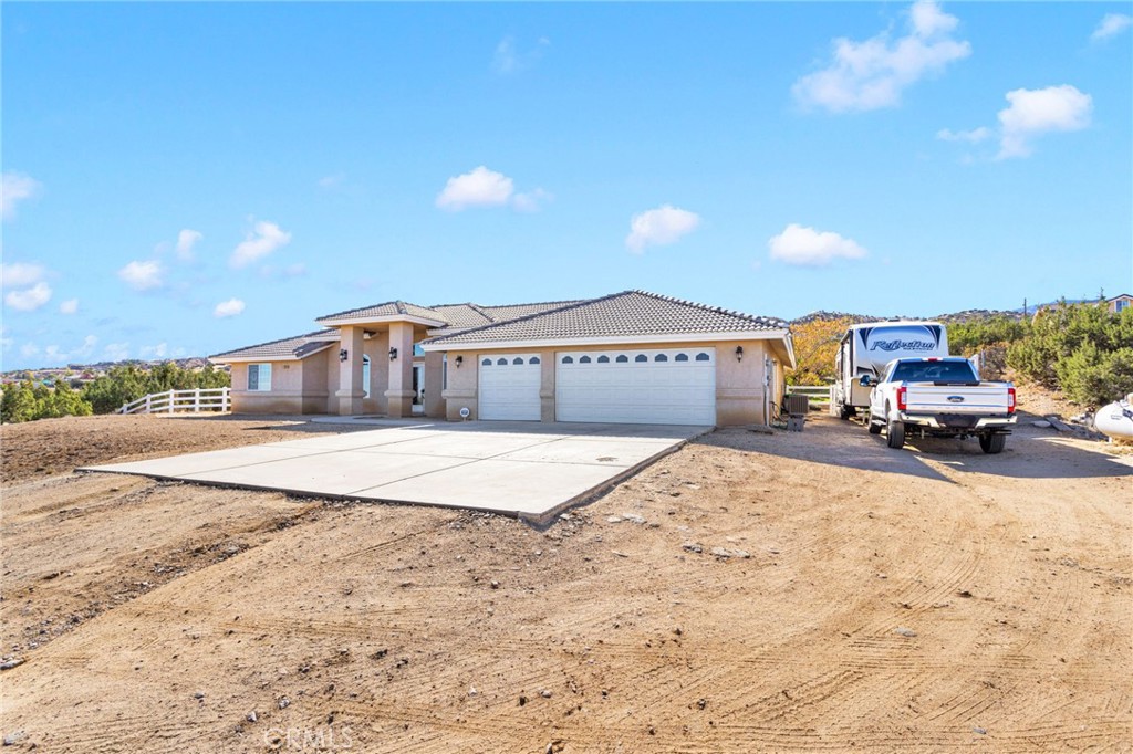 2909 Silver Ridge Drive Pinon Hills, CA 92372 - Photo 3 of 55 a swimming pool with buildings in the background