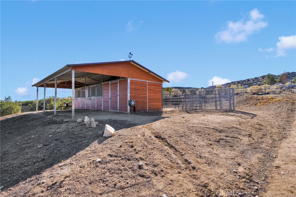 2909 Silver Ridge Drive Pinon Hills, CA 92372 - Photo 39 of 55 a view of a house with a yard