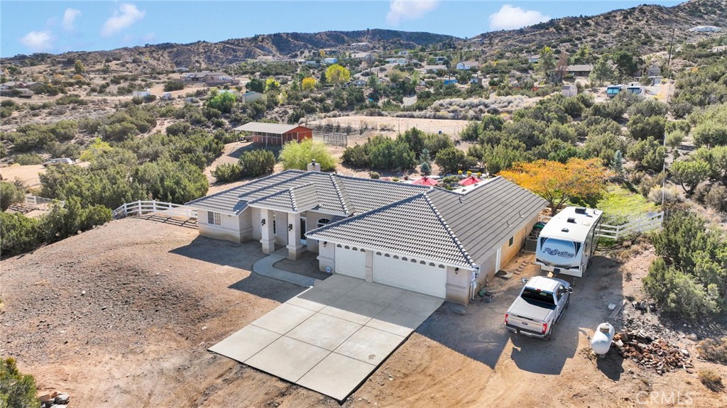 2909 Silver Ridge Drive Pinon Hills, CA 92372 - Photo 47 of 55 an aerial view of a house with a yard