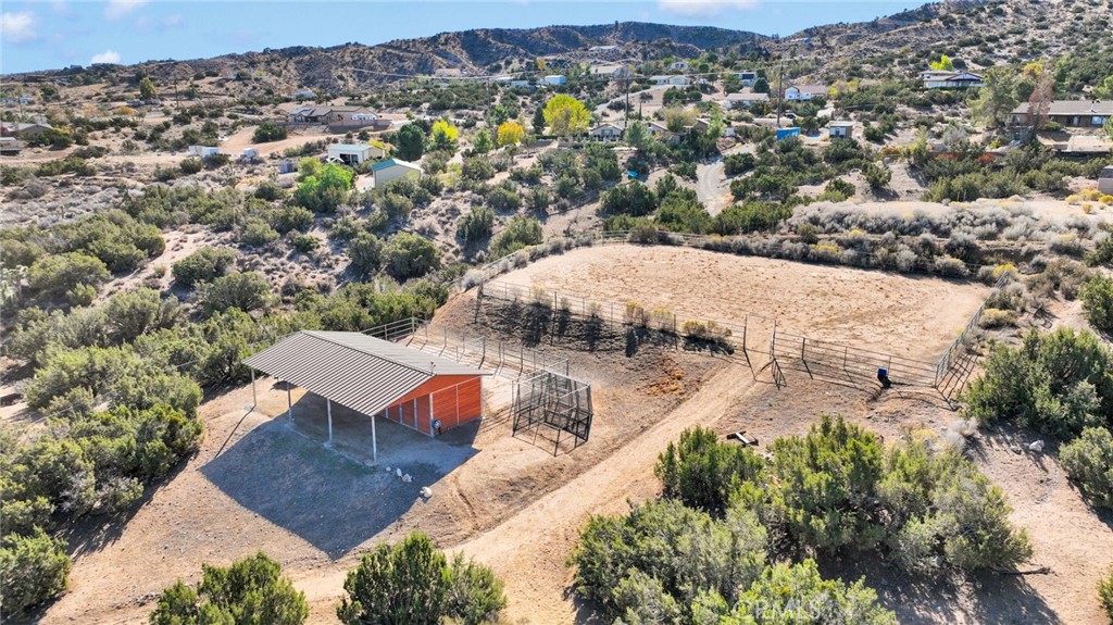 2909 Silver Ridge Drive Pinon Hills, CA 92372 - Photo 48 of 55 an aerial view of a house with yard and mountain view in back