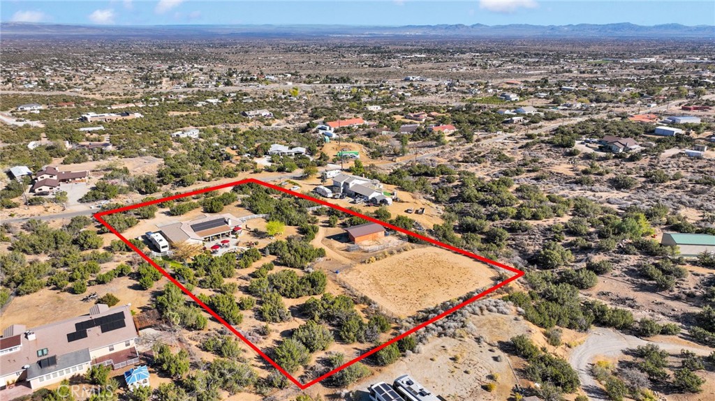 2909 Silver Ridge Drive Pinon Hills, CA 92372 - Photo 51 of 55 an aerial view of a residential apartment building in a city