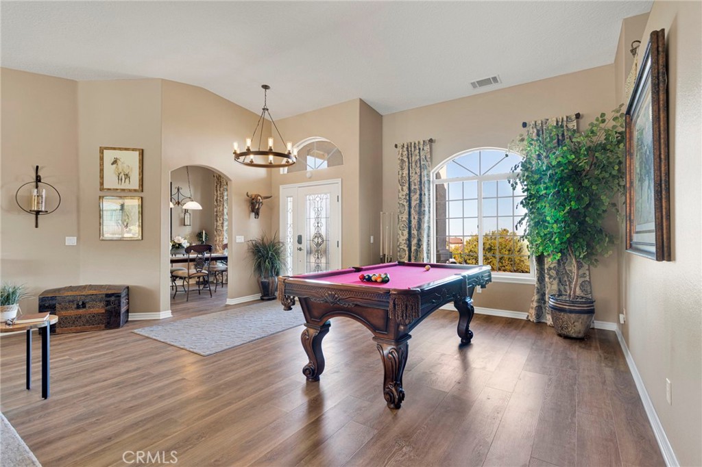 2909 Silver Ridge Drive Pinon Hills, CA 92372 - Photo 6 of 55 a living room with furniture a potted plant and a large window