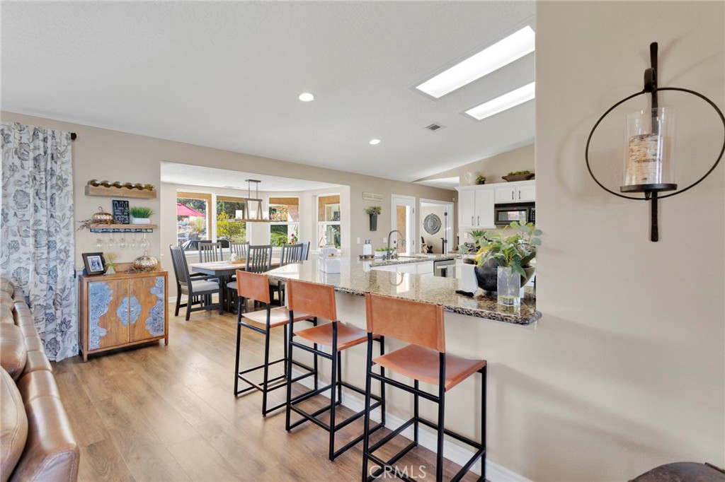 2909 Silver Ridge Drive Pinon Hills, CA 92372 - Photo 10 of 55 a view of a dining room with furniture and wooden floor