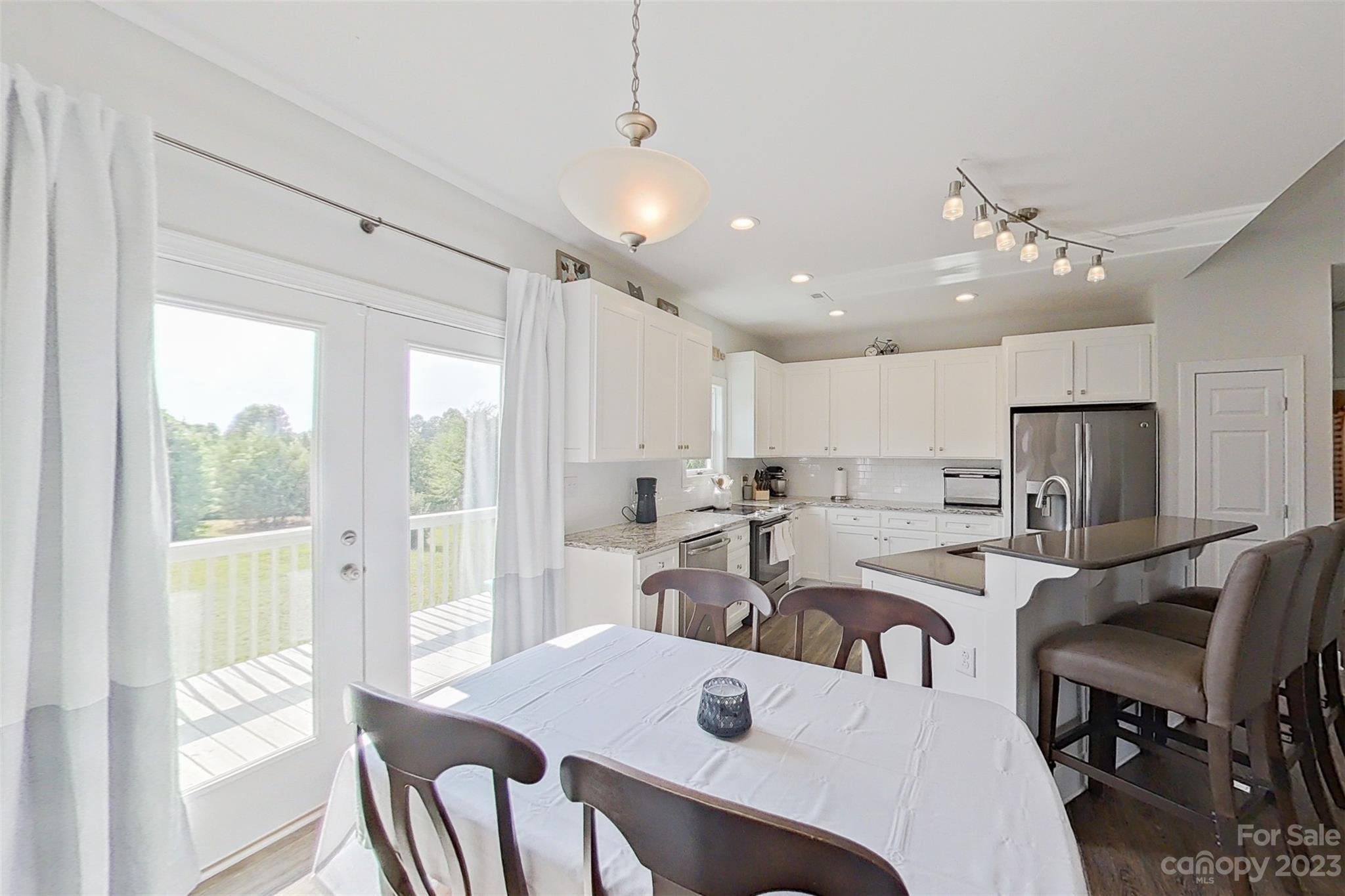 345 Rash Road Olin, NC 28660 - Photo 14 of 39 a view of a dining room and livingroom view
