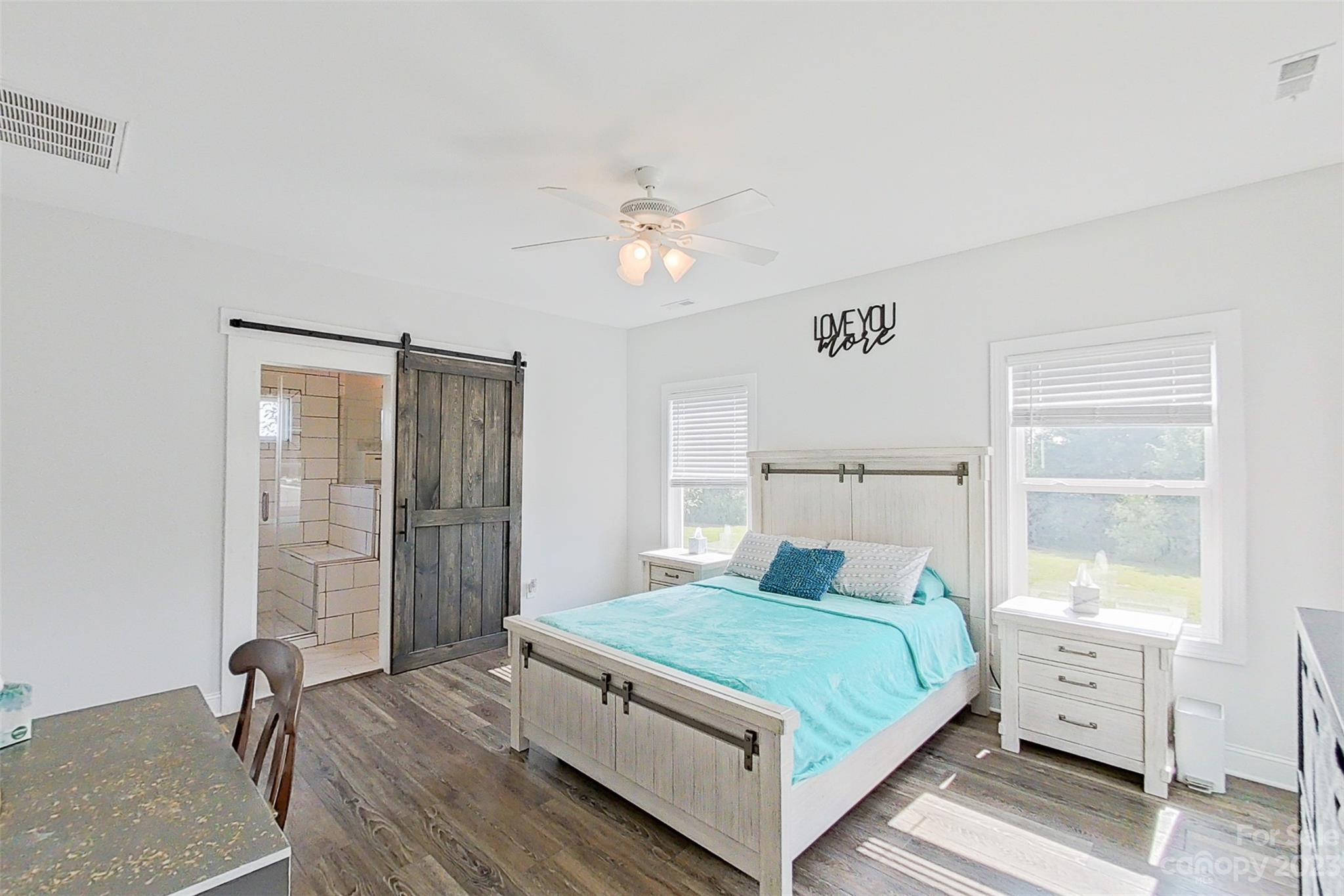 345 Rash Road Olin, NC 28660 - Photo 19 of 39 a bedroom with a bed and a table