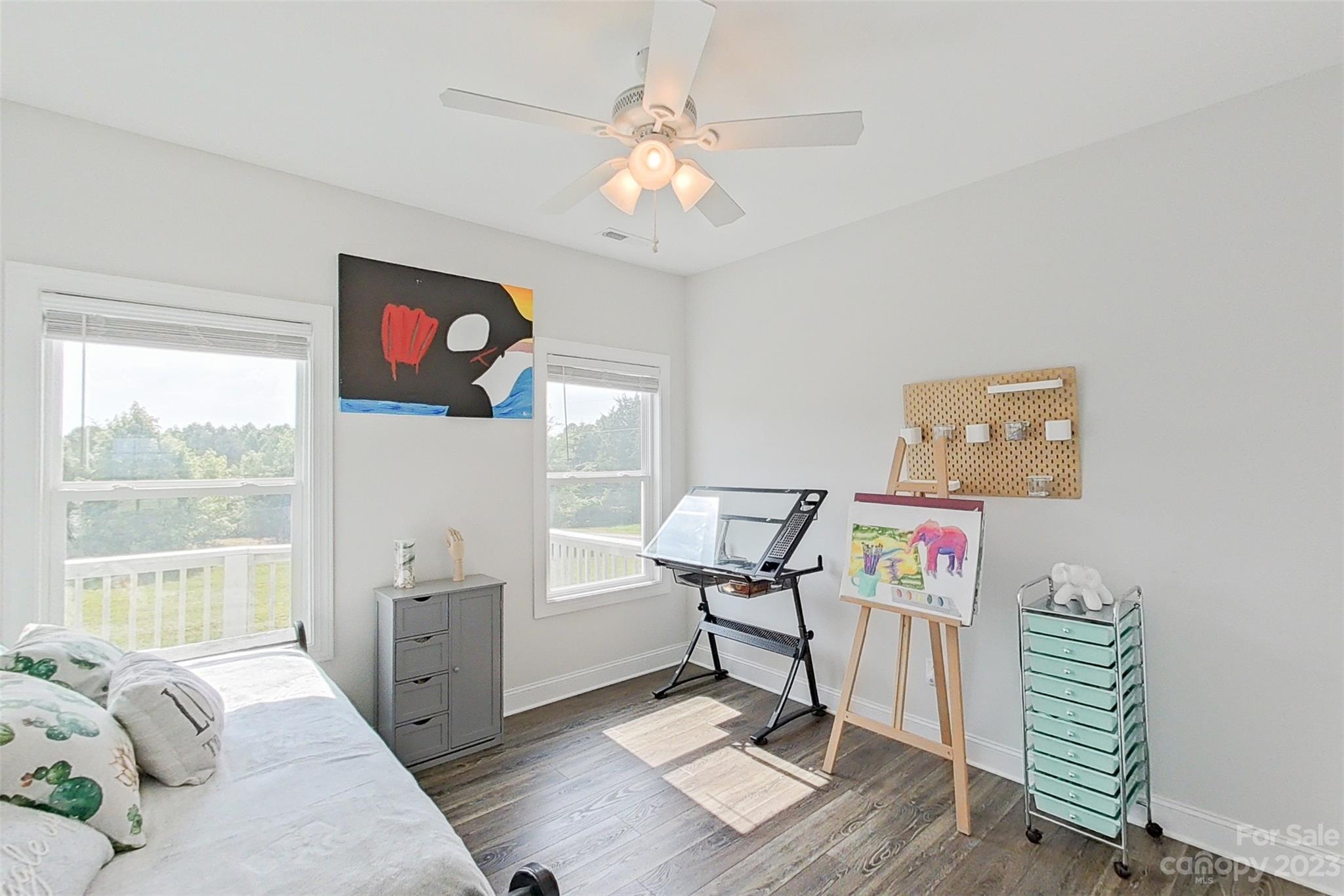 345 Rash Road Olin, NC 28660 - Photo 22 of 39 a living room with furniture and a flat screen tv