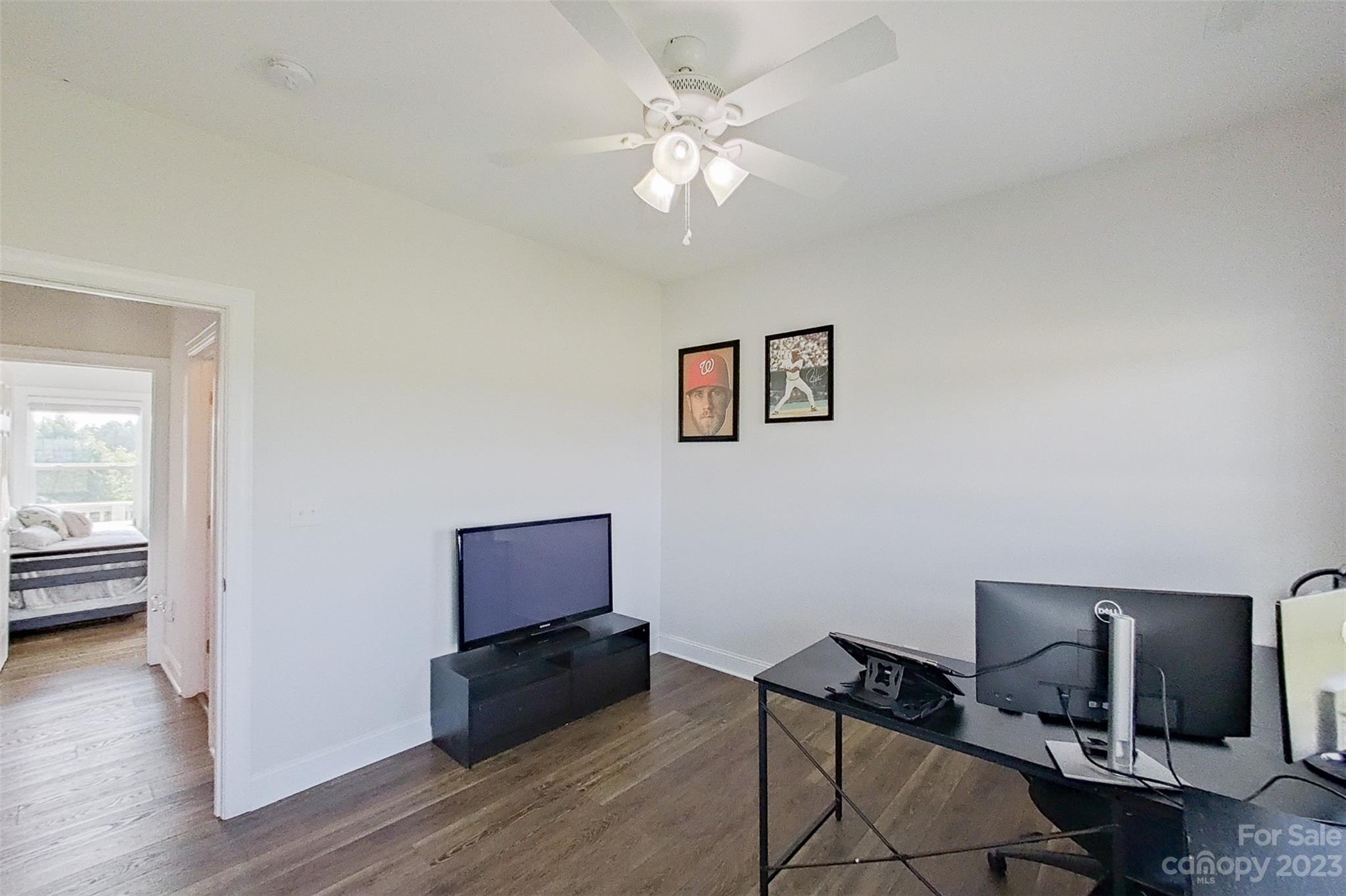 345 Rash Road Olin, NC 28660 - Photo 27 of 39 a living room with furniture and wooden floor