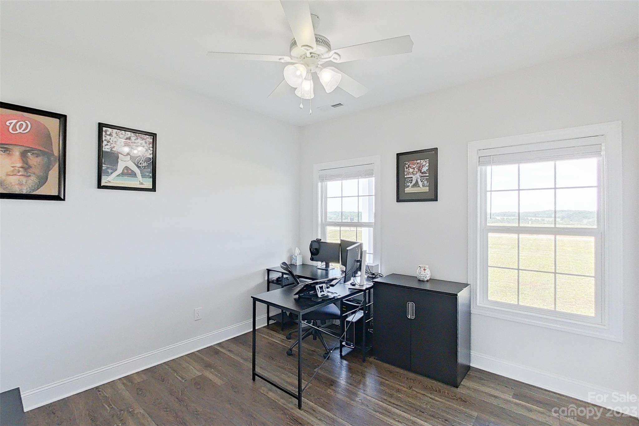345 Rash Road Olin, NC 28660 - Photo 28 of 39 a workspace with wooden floor