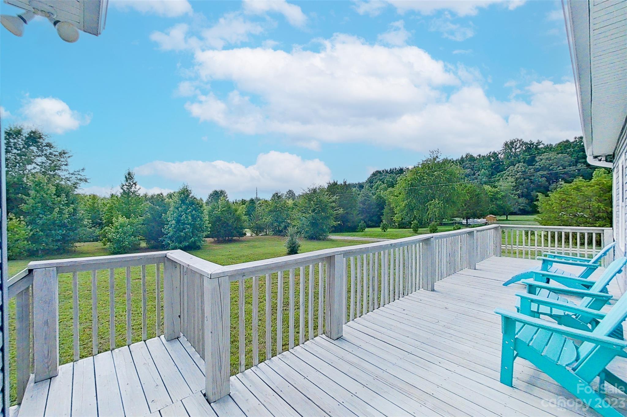 345 Rash Road Olin, NC 28660 - Photo 30 of 39 a balcony with wooden floor and fence