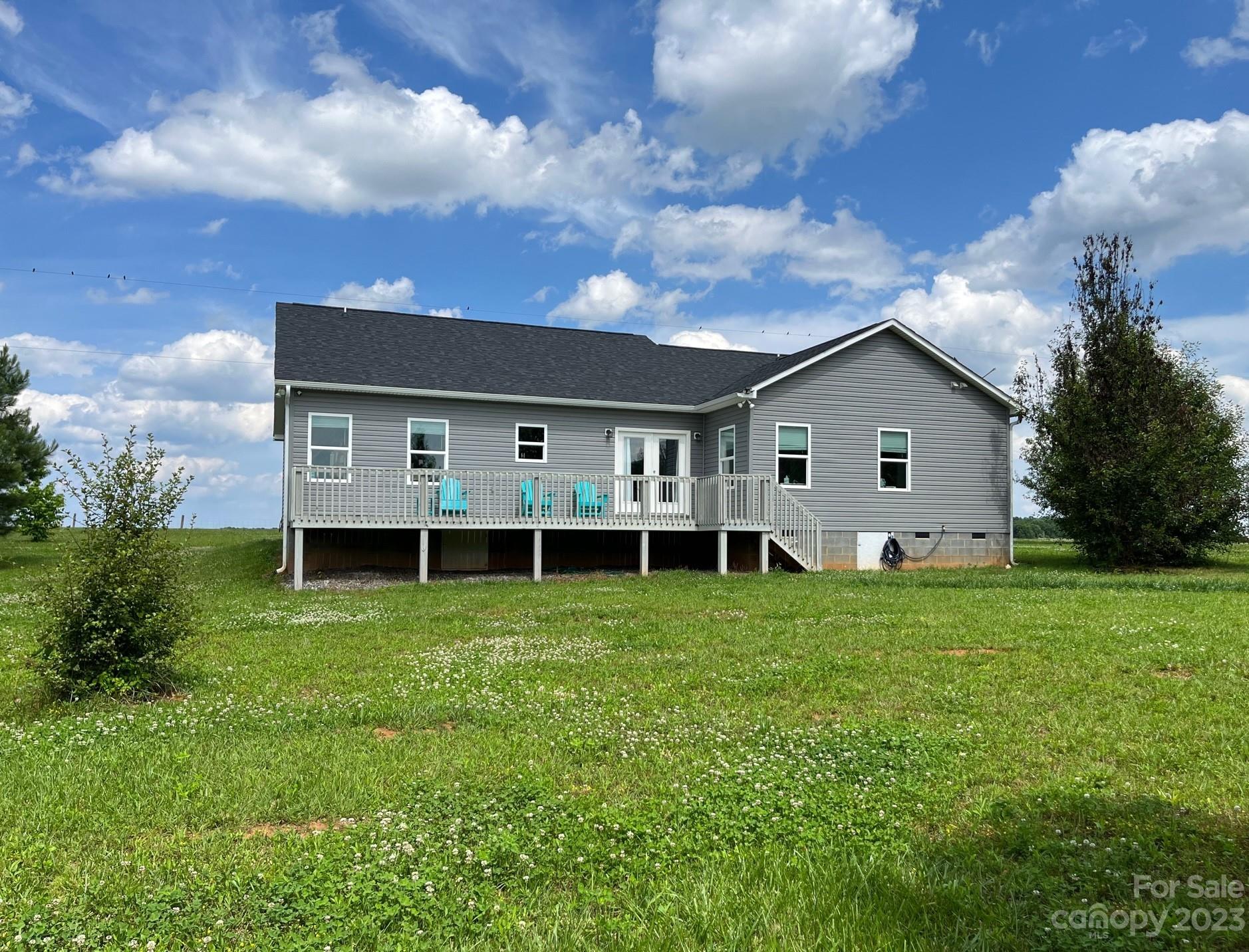 345 Rash Road Olin, NC 28660 - Photo 3 of 39 a view of a house with backyard