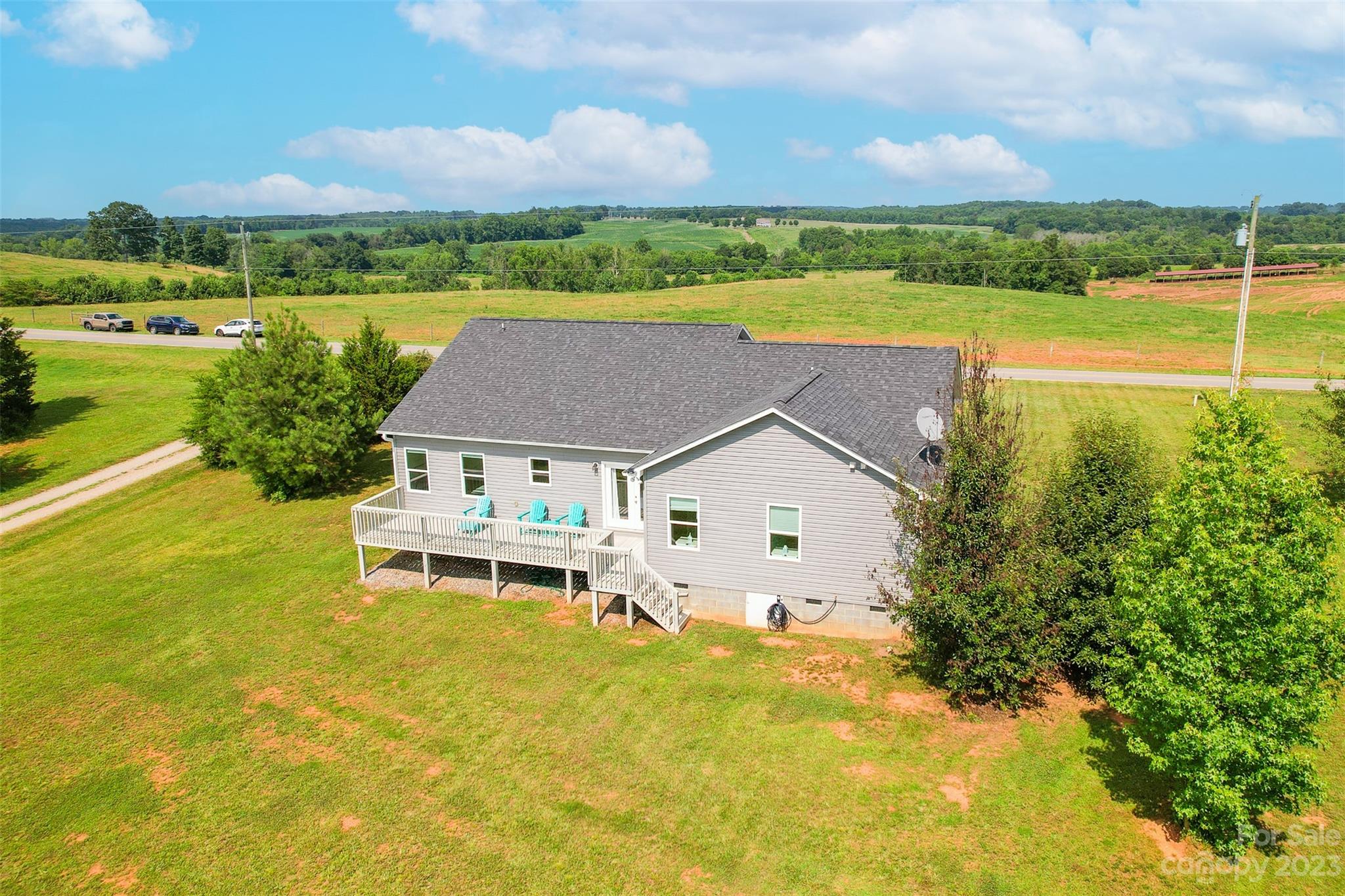 345 Rash Road Olin, NC 28660 - Photo 32 of 39 an aerial view of a house with a ocean view