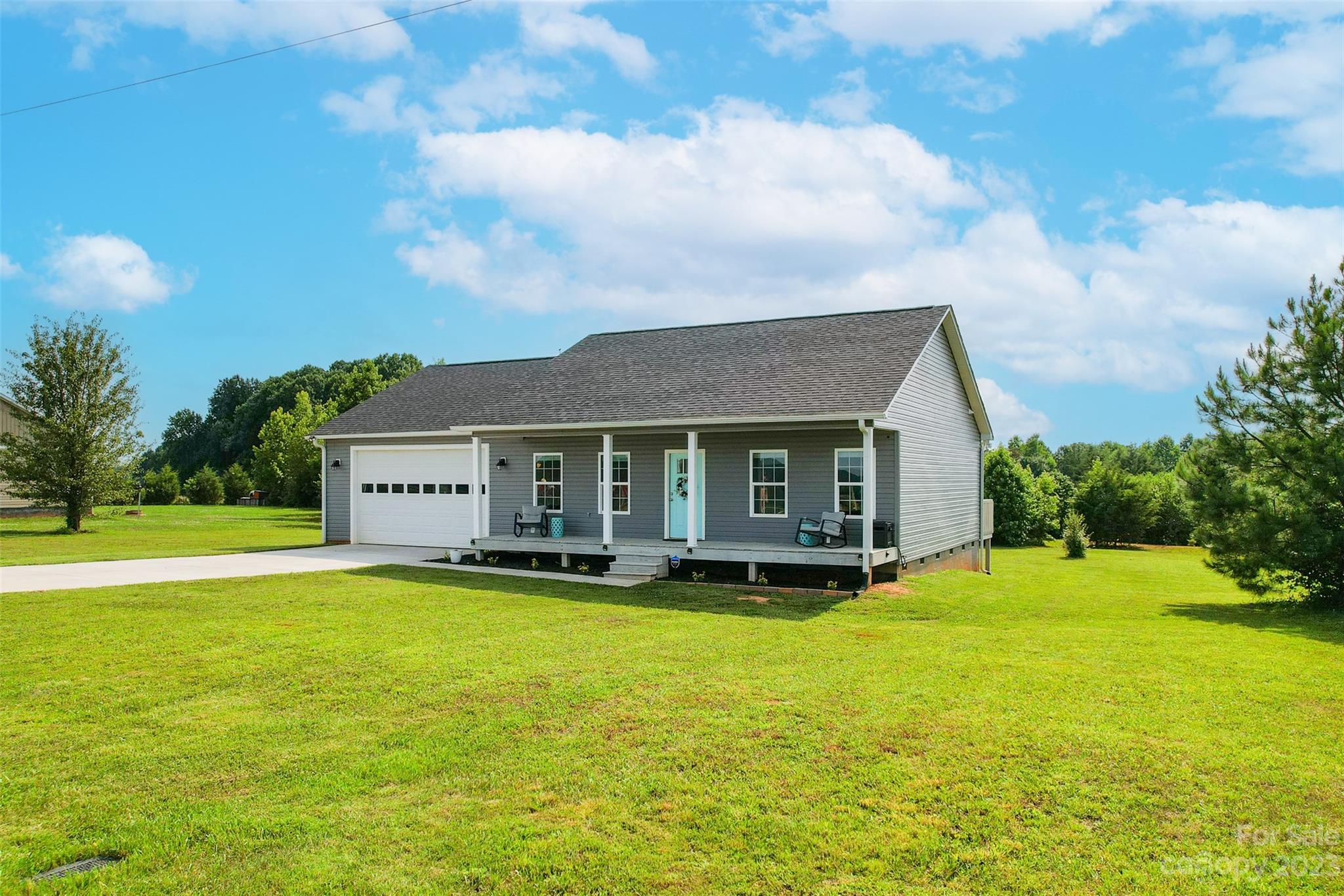 345 Rash Road Olin, NC 28660 - Photo 34 of 39 a view of a house with a big yard
