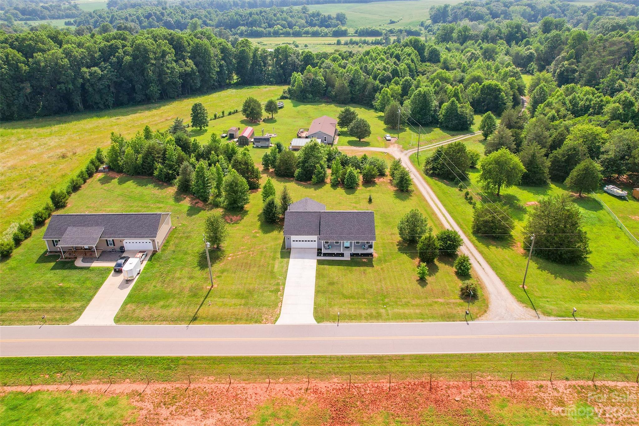 345 Rash Road Olin, NC 28660 - Photo 37 of 39 a view of an swimming pool with a yard