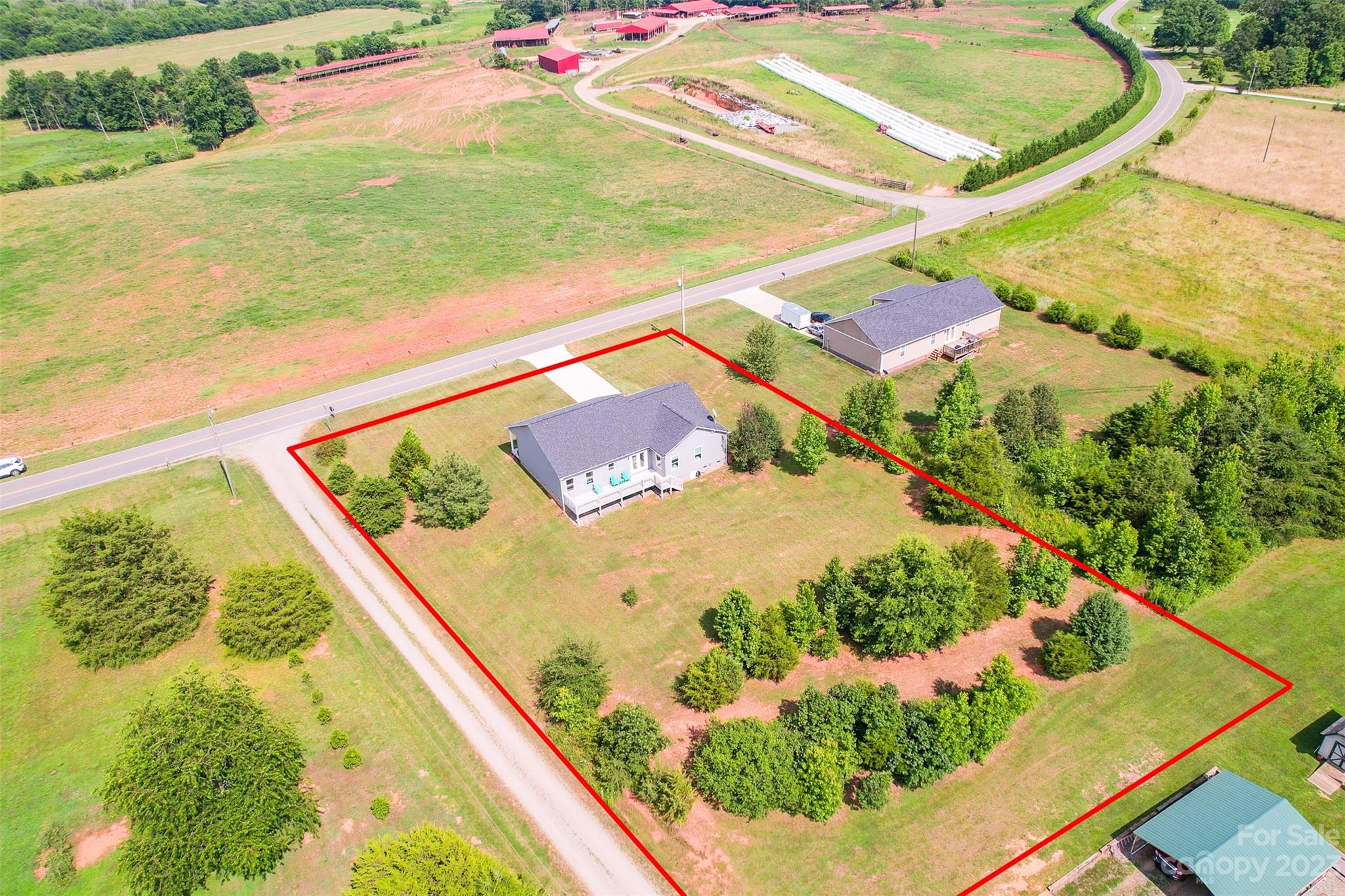 345 Rash Road Olin, NC 28660 - Photo 4 of 39 a view of a swimming pool with a yard