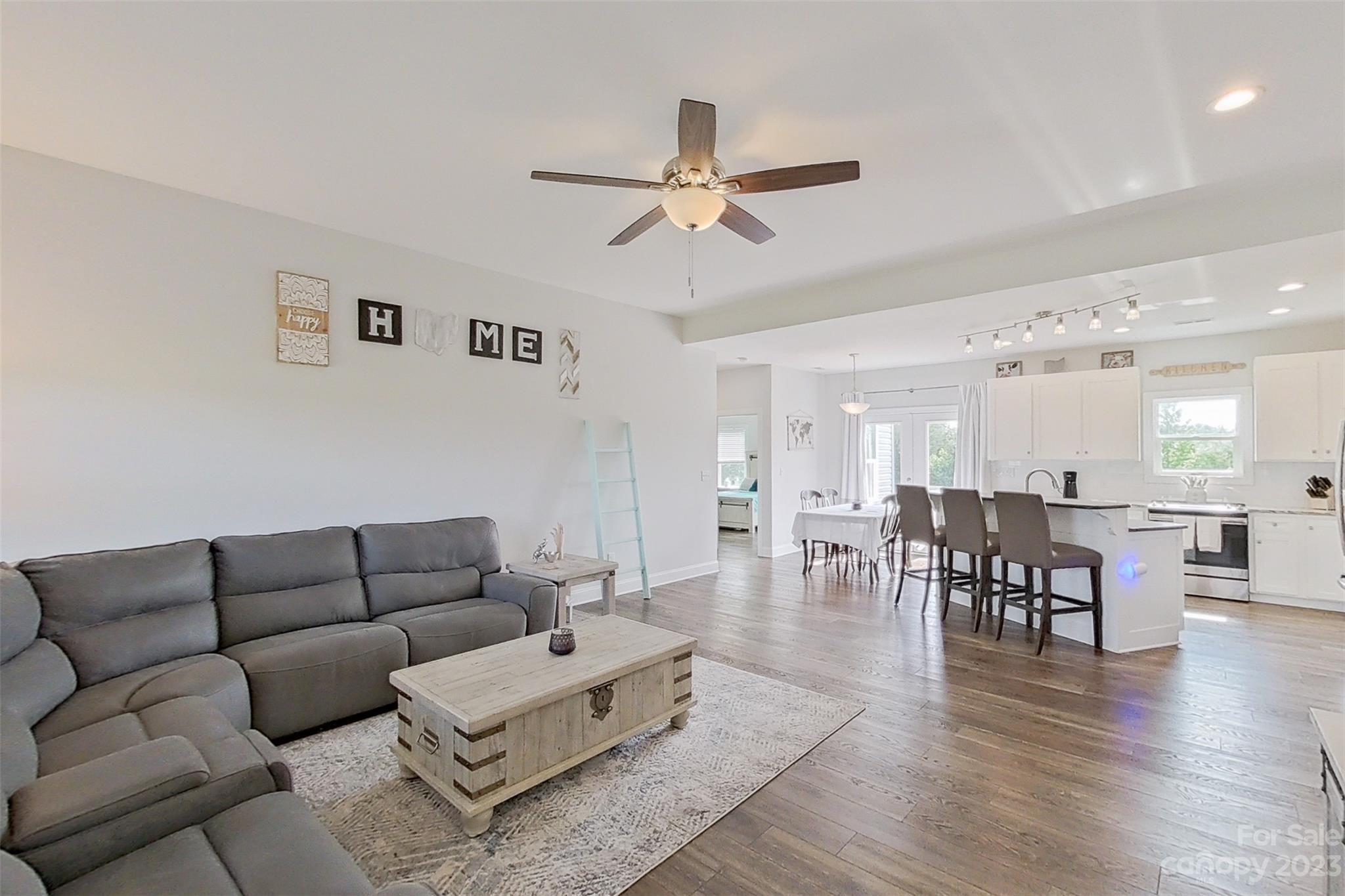345 Rash Road Olin, NC 28660 - Photo 5 of 39 a living room with furniture wooden floor and a dining table
