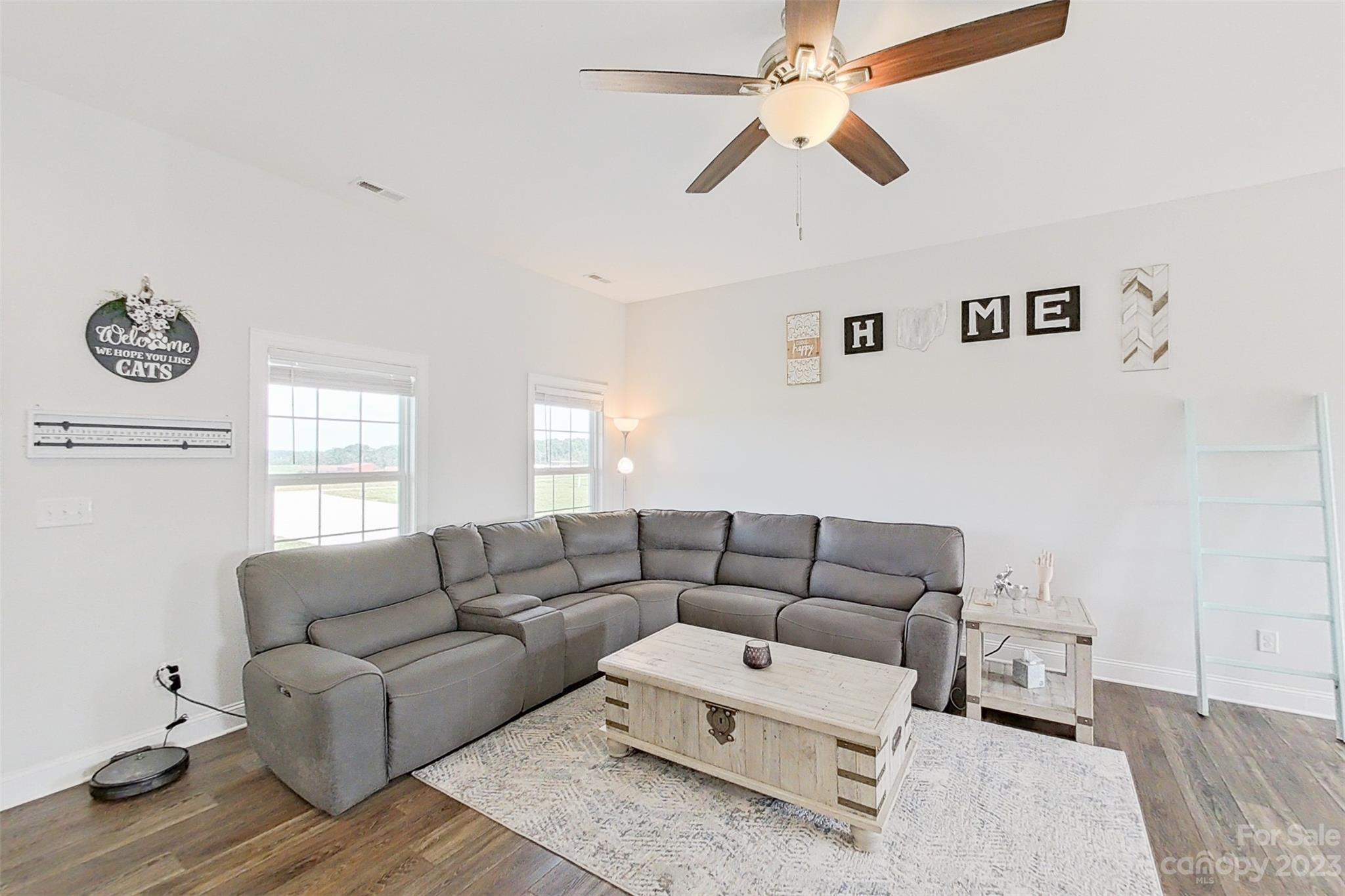 345 Rash Road Olin, NC 28660 - Photo 6 of 39 a living room with furniture and a window