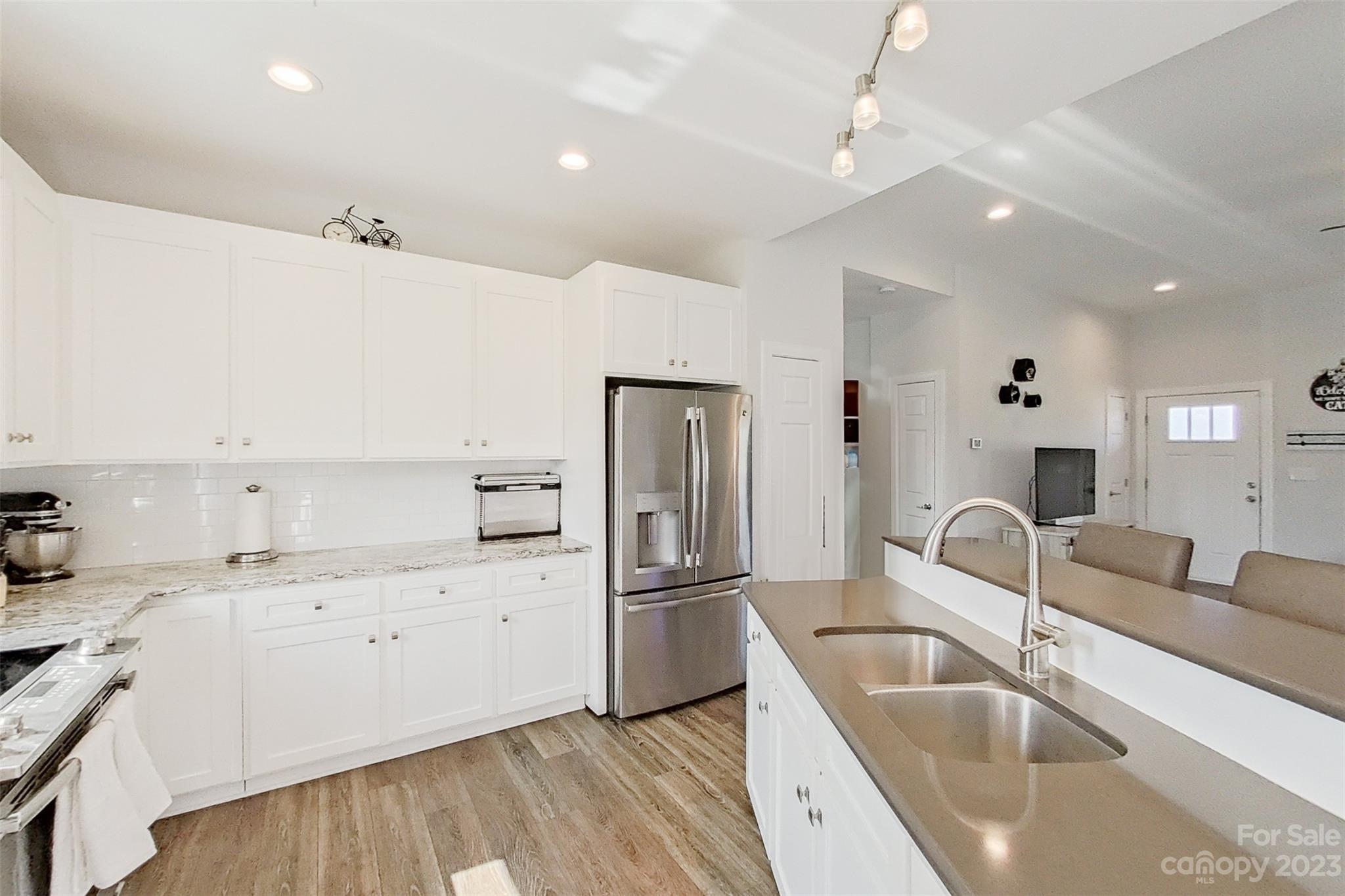345 Rash Road Olin, NC 28660 - Photo 9 of 39 a kitchen with a sink appliances and cabinets