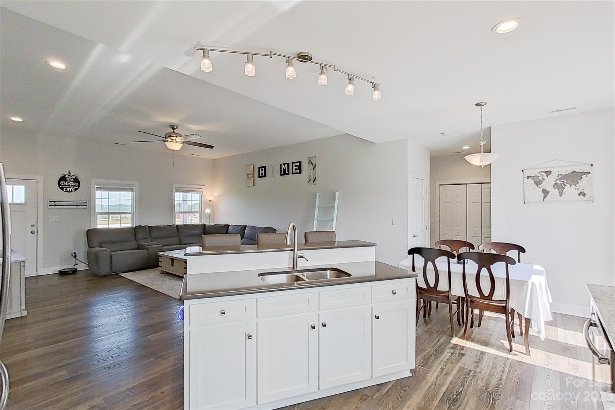 345 Rash Road Olin, NC 28660 - Photo 10 of 39 a large white kitchen with a large window