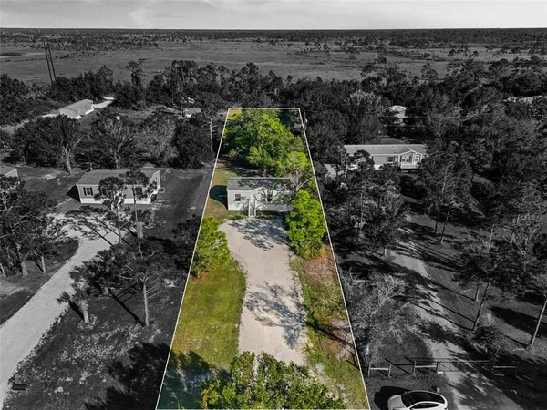 a aerial view of residential houses with outdoor space