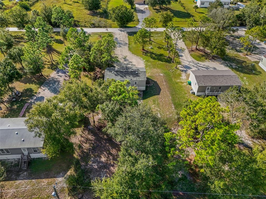 8432 Sweden Boulevard Punta Gorda, FL 33982 - Photo 23 of 23 an aerial view of residential house with outdoor space and trees all around