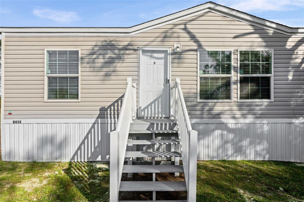 8432 Sweden Boulevard Punta Gorda, FL 33982 - Photo 4 of 23 a front view of a house with a yard