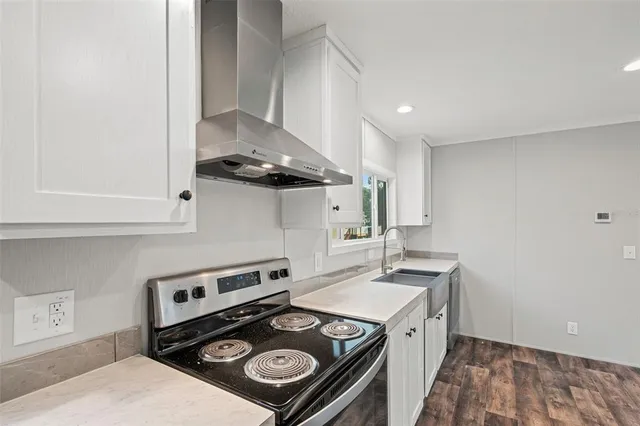 a kitchen with a stove and a refrigerator