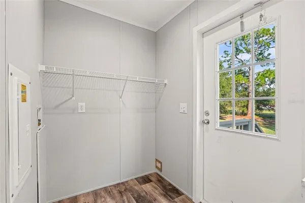 a bathroom with a window and a shower