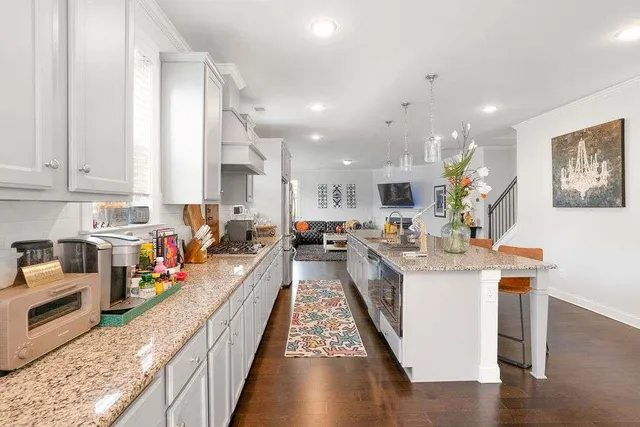 a large kitchen with stainless steel appliances lots of counter space