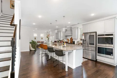 a kitchen with a sink and stainless steel appliances