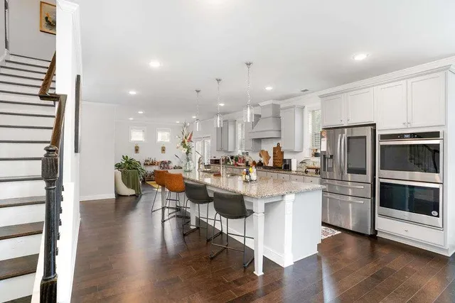 a kitchen with a sink and stainless steel appliances