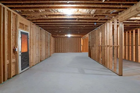 a view of hallway with wooden stairs