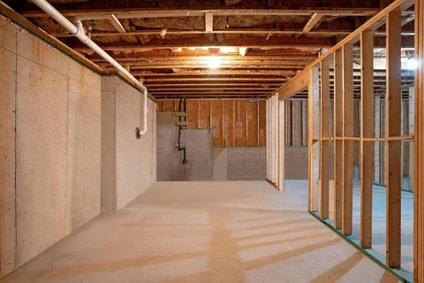 a view of empty room with wooden walls