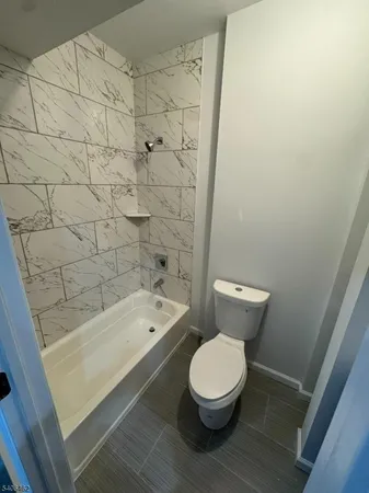 a bathroom with a toilet and a sink