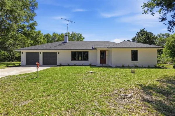 front view of a house with a yard