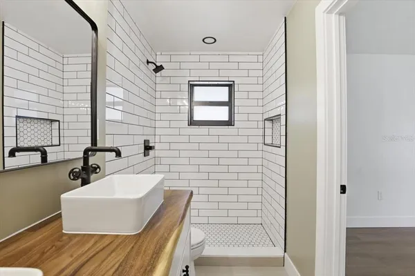 a bathroom with a sink and a mirror