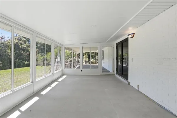 a view of a big room with windows and an outdoor view