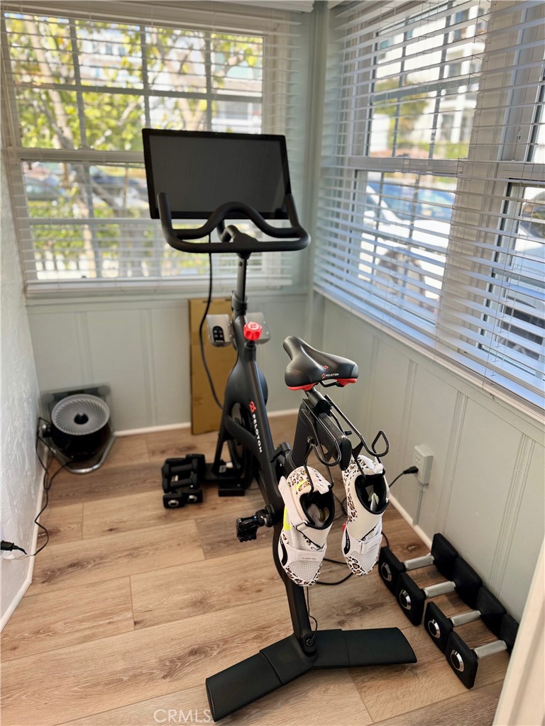 437 Cypress Drive, Unit B Laguna Beach, CA 92651 - Photo 12 of 20 a room with gym equipment and a large window