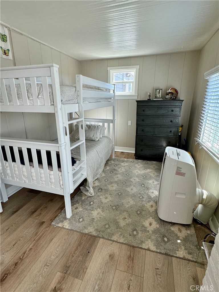 437 Cypress Drive, Unit B Laguna Beach, CA 92651 - Photo 14 of 20 a view of a bedroom with furniture and window
