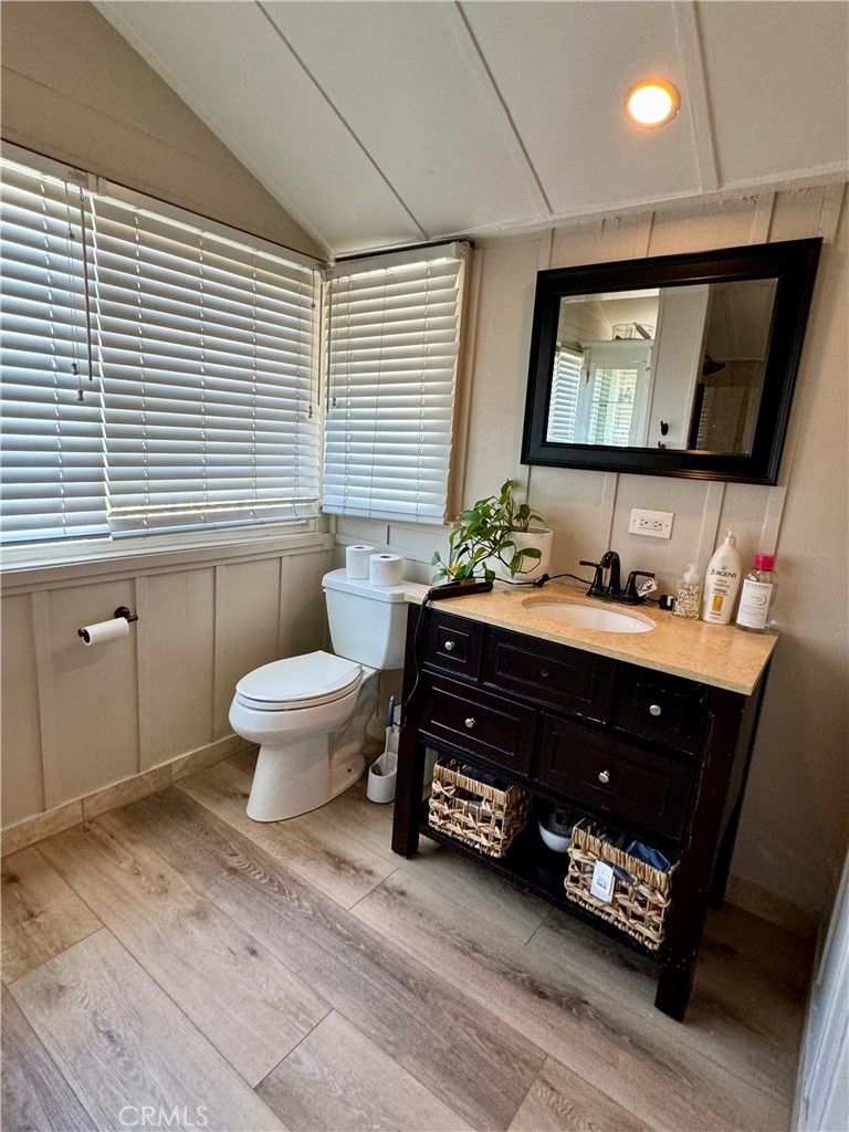 437 Cypress Drive, Unit B Laguna Beach, CA 92651 - Photo 15 of 20 a living room with furniture and a flat screen tv