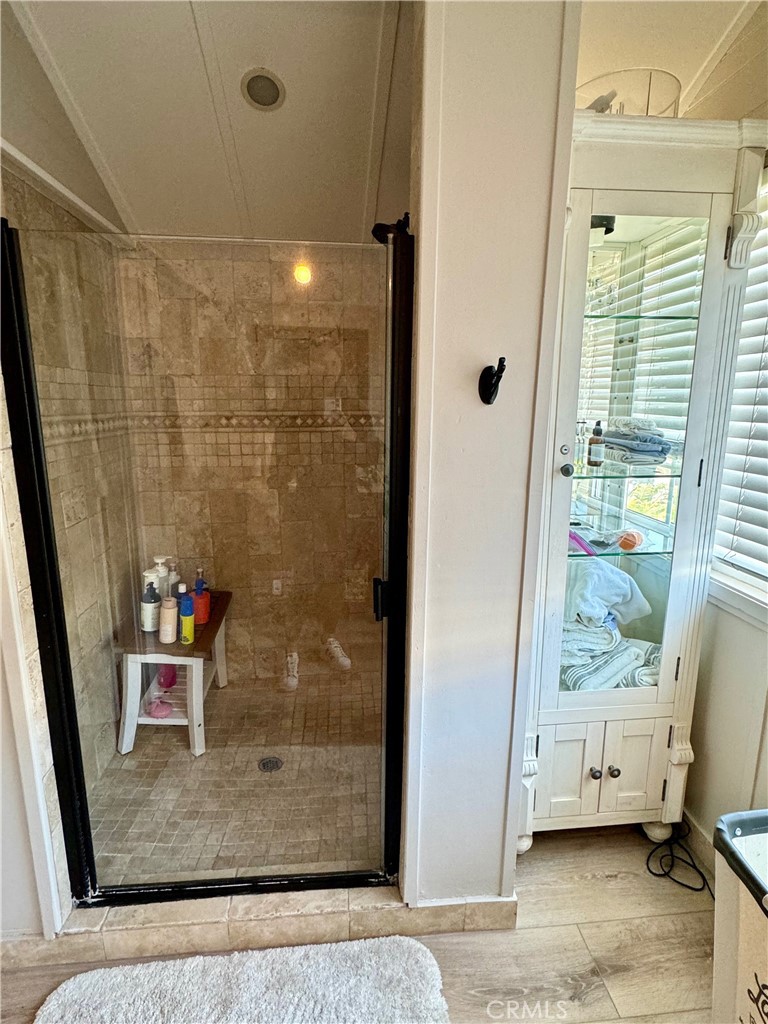 437 Cypress Drive, Unit B Laguna Beach, CA 92651 - Photo 16 of 20 a view of a bathroom with a shower and a sink