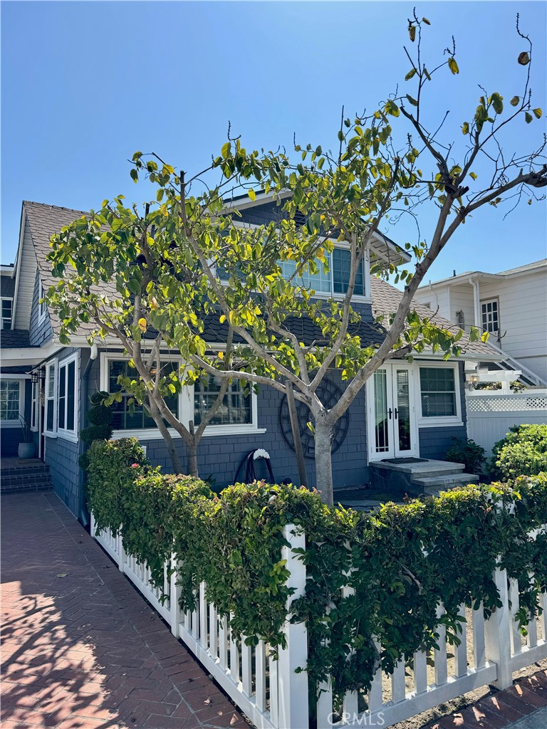 437 Cypress Drive, Unit B Laguna Beach, CA 92651 - Photo 20 of 20 a view of a house with a flower garden
