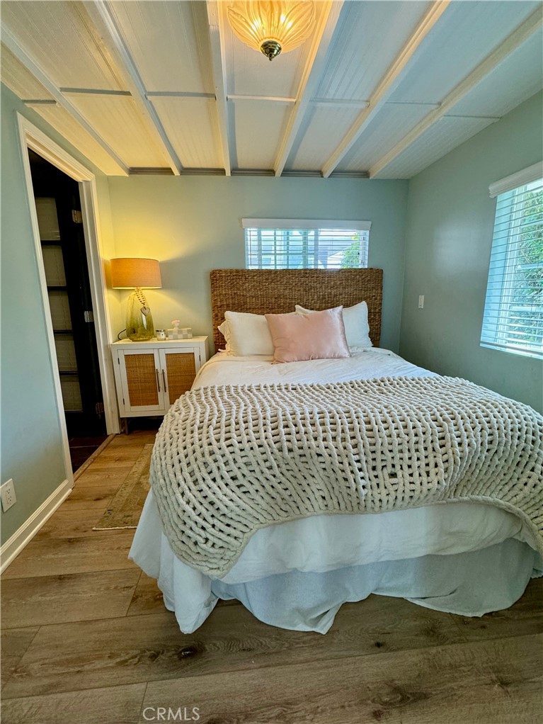 437 Cypress Drive, Unit B Laguna Beach, CA 92651 - Photo 7 of 20 a large bed sitting in a bedroom next to a window