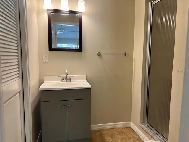 a bathroom with a sink and mirror