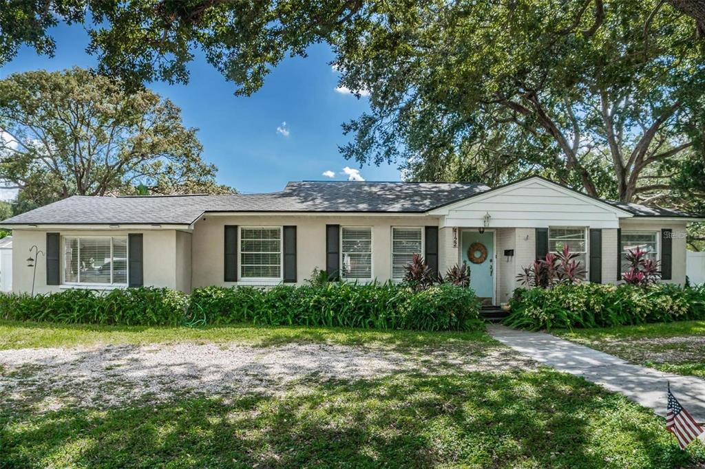 4122 West Empedrado Street Tampa, FL 33629 - Photo 2 of 25 a front view of a house with a garden