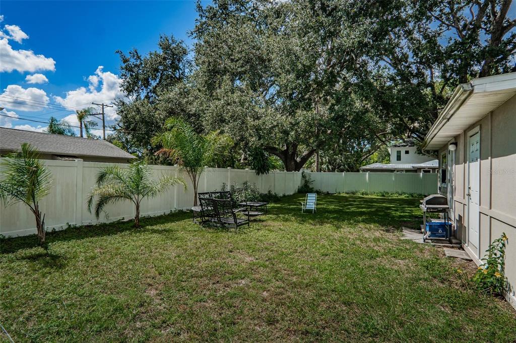 4122 West Empedrado Street Tampa, FL 33629 - Photo 24 of 25 a backyard of a house with bicycles parked and swing
