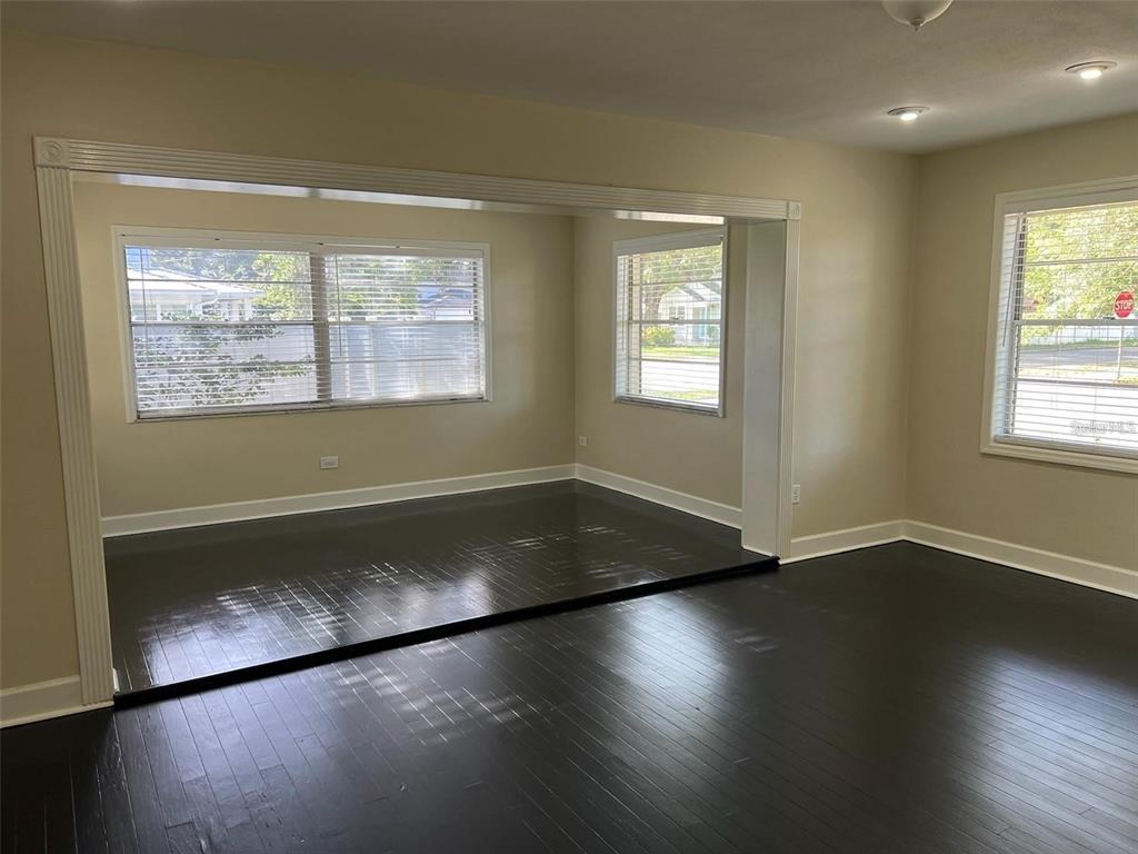 4122 West Empedrado Street Tampa, FL 33629 - Photo 3 of 25 a view of wooden floor in an empty room with a window