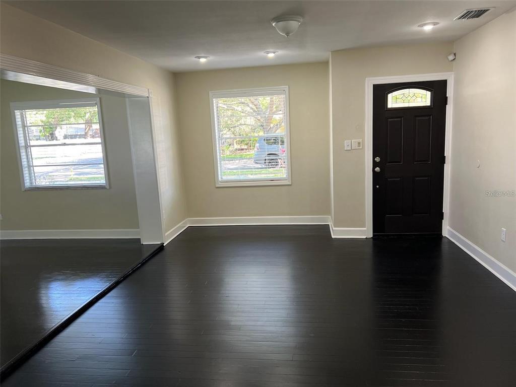 4122 West Empedrado Street Tampa, FL 33629 - Photo 6 of 25 an empty room with wooden floor and windows