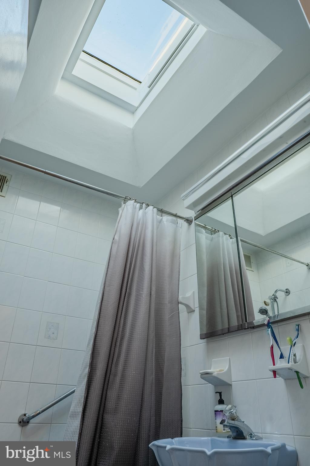 739 Fairfax Road Drexel Hill, PA 19026 - Photo 11 of 18 a bathroom with a shower and a sink