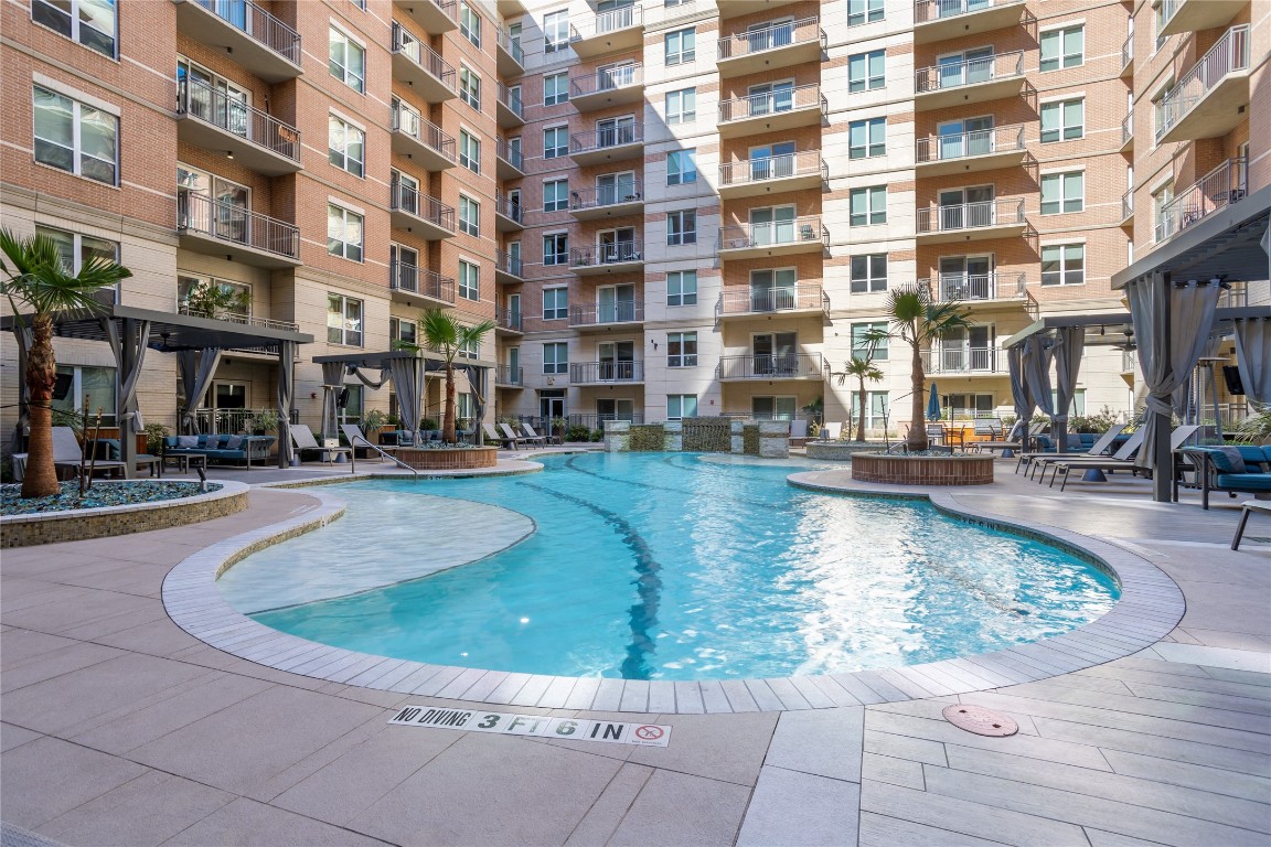2724 Kipling Street, Unit 308 Houston, TX 77098 - Photo 19 of 29 a view of building with swimming pool